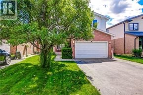 Waterdown apartment for rent - A residential area with a house, a tree, and a car.