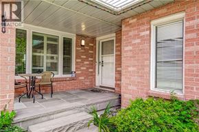 Waterdown apartment for rent - A patio with a table and chairs is shown.