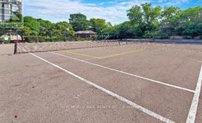 Richmond Hill (Harding) condo for rent - A tennis court with white lines and a yellow line in the middle.
