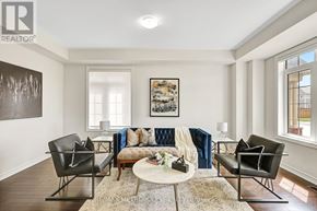 Clarington (Bowmanville) apartment for rent - A living room with a couch, chairs, and a coffee table.