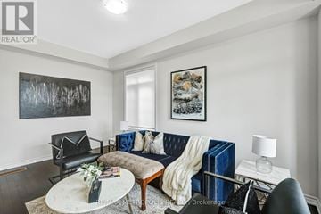 Clarington (Bowmanville) apartment for rent - A living room with a blue couch and a coffee table.