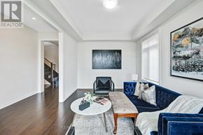 Clarington (Bowmanville) apartment for rent - A living room with a blue couch and a coffee table.