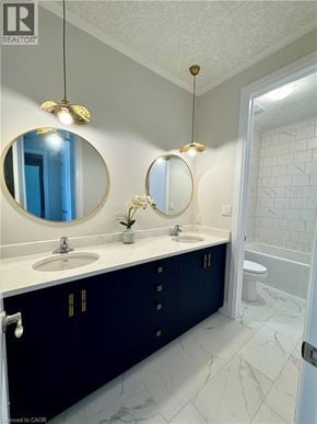Kitchener apartment for rent - A bathroom with a sink and mirror.