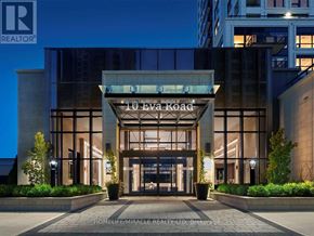 Toronto (Etobicoke West Mall) condo for rent - The entrance to a building with the sign 10 Eva Road.