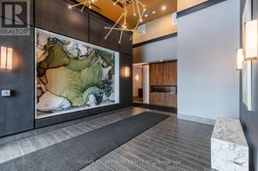 Hamilton (Waterdown) condo for rent - A hallway with a large map on the wall and a bench on the right side.