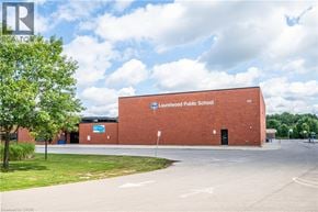 Waterloo apartment for rent - A red brick building with a blue sign that says "Aurewood Public School".