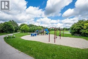 Waterloo apartment for rent - A playground with a slide, swings, and a seesaw.