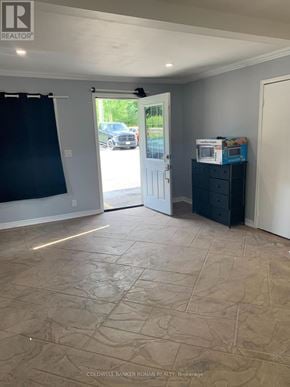 Caledon (Palgrave) apartment for rent - A room with a sliding glass door leading to a parking lot.