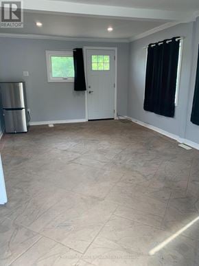 Caledon (Palgrave) apartment for rent - A room with a tile floor and a refrigerator.