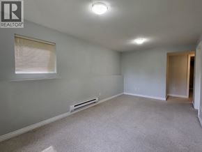 Coquitlam apartment for rent - A room with a window and a heater on the wall.