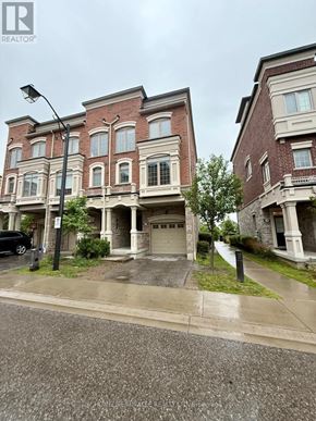 Ajax (Central) townhouse for rent - A street view of a residential area with two red brick houses.