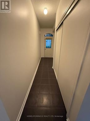 Ajax (Central) townhouse for rent - A hallway with a door at the end.
