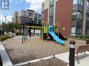 Brampton (Bram East) condo for rent - A playground with a blue slide and a yellow slide.