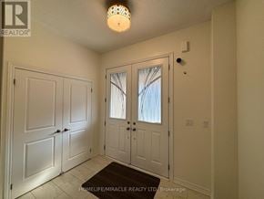 Caledon apartment for rent - A white door with a window in the middle of it.