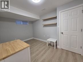 Coquitlam apartment for rent - A room with a white door, a wooden table, and a bench.