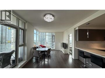 Burnaby apartment for rent - A well-lit living room with a dining table and chairs.