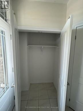 Barrie townhouse for rent - A white hallway with a door on the right.