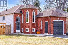 Wasaga Beach apartment for rent - A red brick house with a black garage door.
