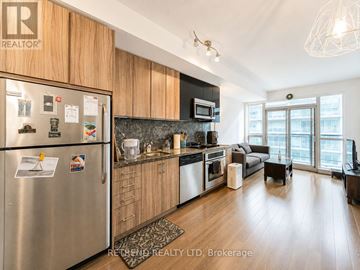 Toronto (Mount Pleasant West) condo for rent - A kitchen with a refrigerator, stove, and microwave.
