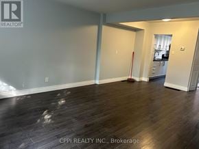 Toronto (Don Valley Village) townhouse for rent - A brokerage office with wood flooring and a broker logo.