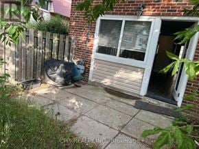 Toronto (Don Valley Village) townhouse for rent - A house with a broken window and a bag on the ground.