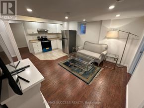 Milton (Ha Harrison) apartment for rent - A kitchen with white cabinets and a wooden floor.