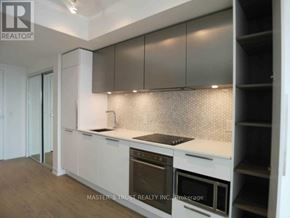 Toronto (Church-Yonge Corridor) condo for rent - A kitchen with a white countertop and stainless steel appliances.