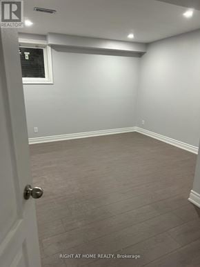 Bradford West Gwillimbury (Bradford) apartment for rent - A room with a door and a window.