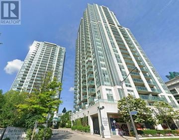 Toronto (Willowdale East) condo for rent - A tall residential building with a sign that says "The Resident".