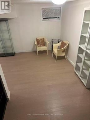 Toronto (L'amoreaux) townhouse for rent - A room with a chair and a table in it.