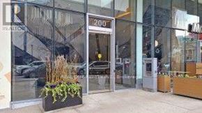Toronto (Annex) condo for rent - A building with a glass facade and a sign that reads "2010" is visible.