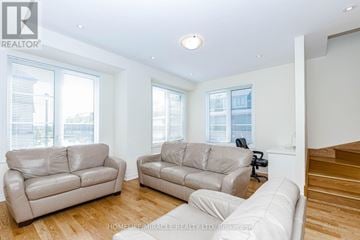 Brampton (Goreway Drive Corridor) townhouse for rent - A living room with two couches and a staircase.