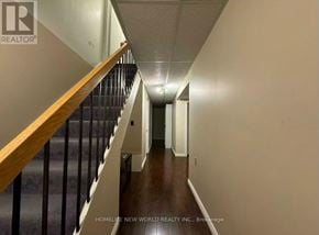 Toronto (Agincourt North) apartment for rent - A long hallway with a staircase on the left side.