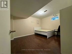 Toronto (Agincourt North) apartment for rent - A bedroom with a bed, a chair, and a window.