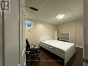 Toronto (Agincourt North) apartment for rent - A bedroom with a bed, chair, and a small closet.