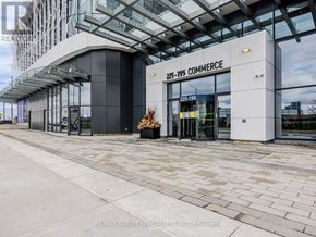 Vaughan (Vaughan Corporate Centre) condo for rent - The entrance to a building with the sign ZZZ-199 COMMERCE.