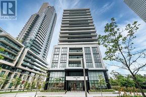 Toronto (Mimico) condo for rent - A modern building with the sign "REALTY" in front of it.