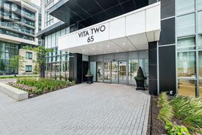 Toronto (Mimico) condo for rent - The entrance to a building named Vita Two with a brick walkway leading to the glass doors.