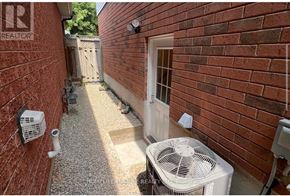 Toronto (Centennial Scarborough) apartment for rent - A small alley with a fan and a door.