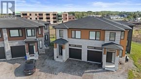 Niagara Falls (Brown) apartment for rent - A car is parked in front of a house with a sign that says Brokerage.