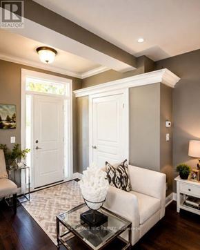 Niagara-On-The-Lake (Town) townhouse for rent - A living room with a white couch and a glass coffee table.