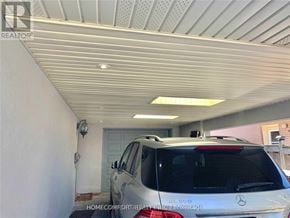 Toronto (Willowridge-Martingrove-Richview) apartment for rent - A Mercedes-Benz SUV is parked in a garage.