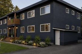 Chilliwack apartment for rent - A modern house with a balcony and a white door.