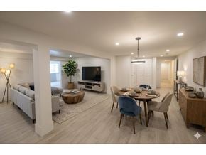 Chilliwack apartment for rent - A modern living room with a dining area and a television.