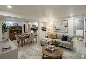 Chilliwack apartment for rent - A modern living room with a dining table and a sofa.