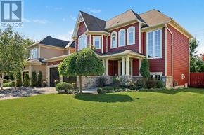Collingwood apartment for rent - A large red house with a stone wall in front.