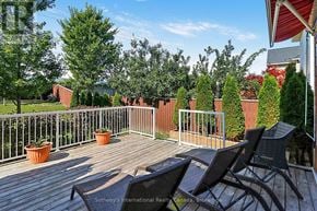 Collingwood apartment for rent - A deck with chairs and a railing overlooking a yard.