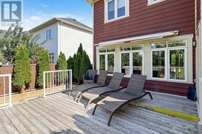 Collingwood apartment for rent - A deck with two lounge chairs and a railing.