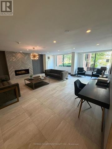 Burlington (Brant) condo for rent - A living room with a black table and chairs.