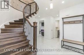 Barrie (West Bayfield) apartment for rent - A staircase with a metal railing and wooden steps.